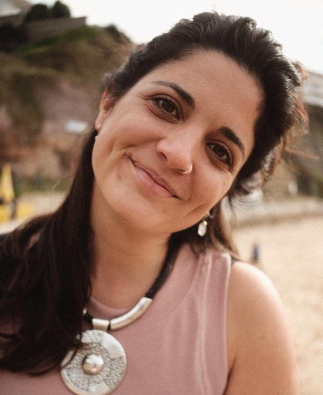 Flor – Espacio Medrar contact Flor, founder of Espacio Medrar, warm and approachable portrait next to contact details